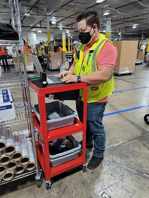 Gabriel Valdivieso, the 2nd Shift Supervisor working on the warehouse floor.